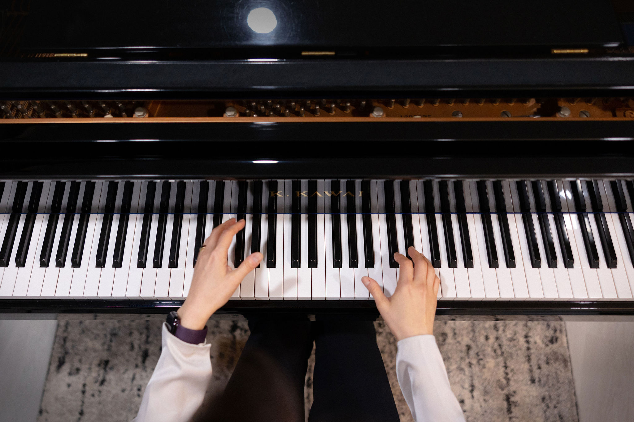Hands playing piano keys at Gia Ree Piano Studio